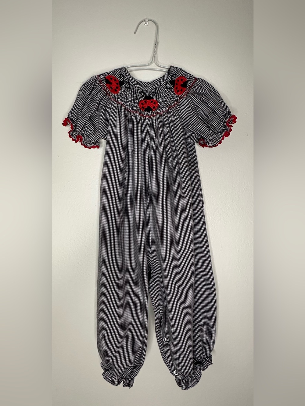 Smockadot Kids 9 month size with ladybug smocking with snap crotch .